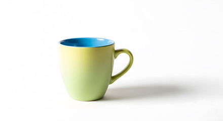 Yellow and green gradient coffee mug with a blue interior, isolated on a white background.