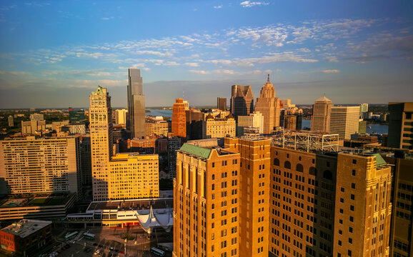 Aerial view of Detroit downtown many skyscrapers under evening sunlight. Detroit is also known as Motor city because its ties to the Auto Industry.