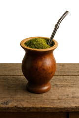 Experience authentic South American tradition with this rustic yerba mate gourd and bombilla on a wooden surface