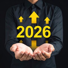 Hands holding 2026 with upward arrows, signifying growth