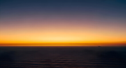 Seascape at Sunset with Golden Sky and Calm Water