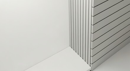 Obraz premium White wall with grey slatted paneling and baseboard.