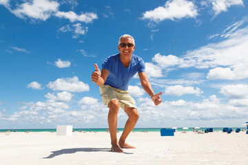 Handsome middle age man enjoying the beach