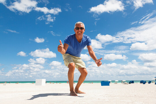 Handsome middle age man enjoying the beach