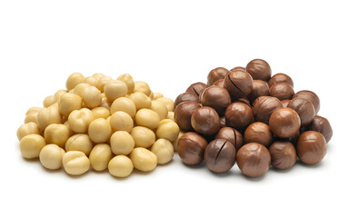 Two piles of macadamia nuts, one shelled and one in shell, isolated on white background