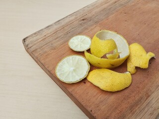 Fresh peeled lime peel on cutting board, high angle view 