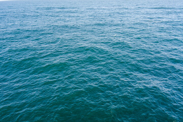 Aerial view of a blue water background of the Pacific Ocean