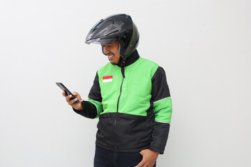 Asian online taxi driver holding smartphone isolated over white background