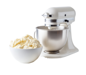 Creamy dough in bowl, beside a stand mixer