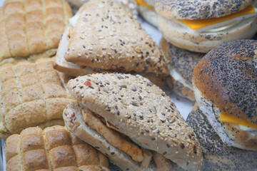 Freshly baked assorted bread rolls and sandwiches for lunch