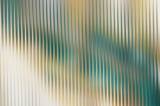 A visually appealing abstract background featuring a series of vertical, slightly wavy stripes.