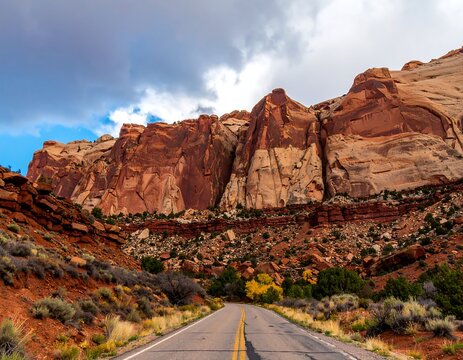 Road winding through red rock canyon