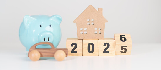 2025 end year to Happy New Year 2026 with car and Home model with coin stack. Car loan, Interest rate, real estate, house, Insurance, Financial, Repair, Tax, mortgage and Maintenance