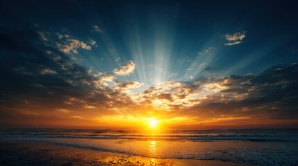 Obraz premium A vibrant sunset over the ocean with a golden sun setting behind the clouds.