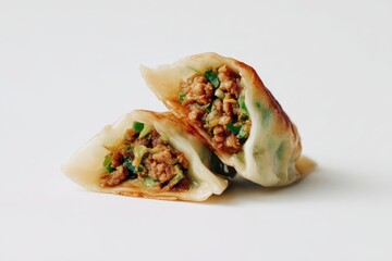 Delicious Dumplings - A Close-Up of Two Halves on White.