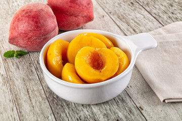 Sweet ripe yellow canned peaches
