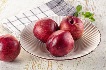 Ripe sweet juicy nectarines heap