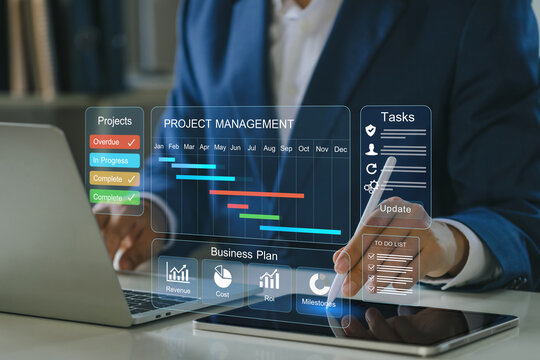 Project management tool concept. Businessmen use laptop to manage a dashboard with Gantt timeline, tasks, and business plan KPI on tablet and laptop. Visualizes planning, scheduling, resource tracking
