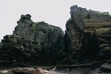 Scenery around Yongmeori Coast(Dragon head coast), a tourist attraction famous for Multistory layered rough and strange sedimentary rocks in Jeju Island, South Korea.