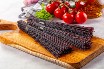 Raw black rice noodles lines