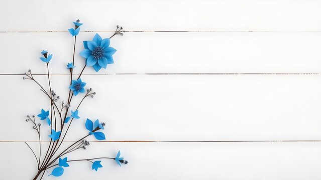 Celebration concept with blue decorative elements on a white wooden background.