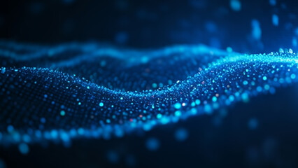Abstract blue wave of glowing particles on a dark background with luminous sparks and dynamic energy that create a futuristic and radiant digital atmosphere.