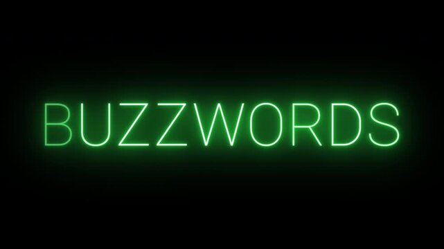Flickering neon green buzzwords sign animated on black background.

