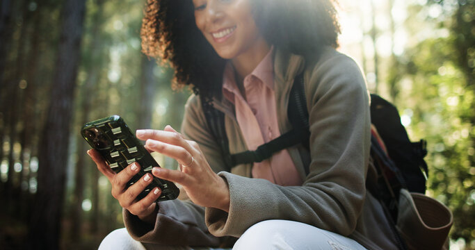 Hiking, hands and woman with phone in forest for location search, check map and travel adventure. Trekking break, hiker and happy with smartphone in nature for online navigation, direction or texting
