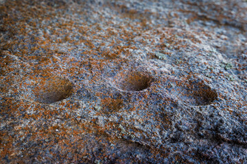 Prehistoric cup marks carved in granite rock at Los Barruecos Spain