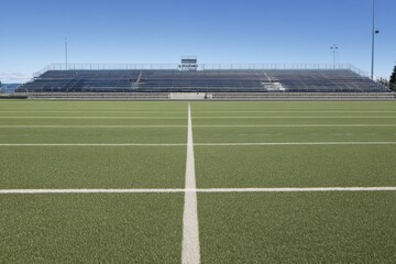 Fototapeta premium High-Quality Empty Soccer Stadium with Green Grass Field and White Grid Lines Modern Sports Venue for Professional Event Marketing and Inspiring Audience Engagement