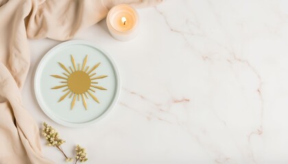 Decorative plate with sun motif and candle on marble background, concept of Winter Solstice  