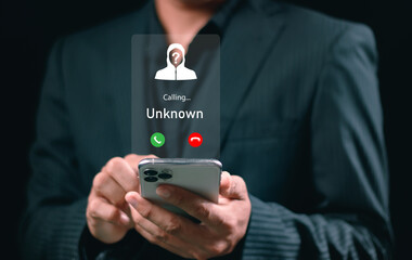 Fraud and phishing concept. Man holding mobile phone with incoming call from unknown caller. scammer or stranger, Hoax person with fake identity, Prank caller, anonymous, smartphone, unwanted, spam,