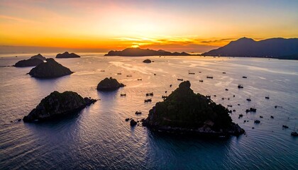 Sunrise over a tranquil bay dotted with islands and boats