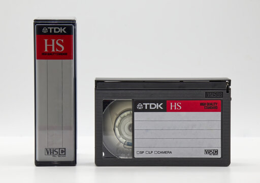 Bologna - Italy - September 15, 2025: A TDK HS VHS-C high quality standard video cassette and protective case on a clean white background.