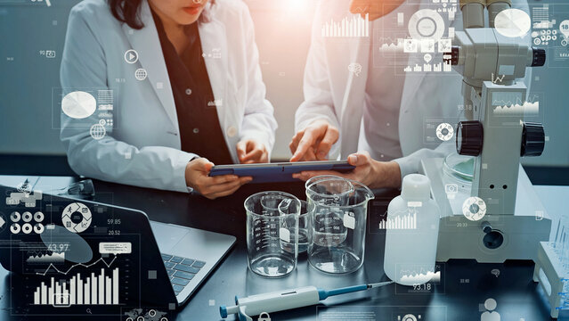 Scientists meeting with statistical data