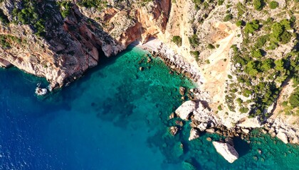 Fototapeta premium Coastal cliffs meet turquoise sea (1)