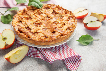 Delicious homemade apple pie decorated with fresh apple slices and leaves