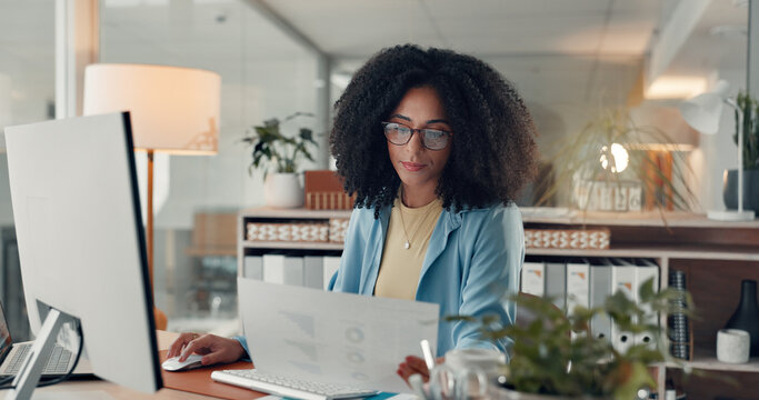 Reading, paperwork and woman with computer in office, serious or working late for data entry on web. Online, accountant and African person with glasses for financial report, graphs and tech at night