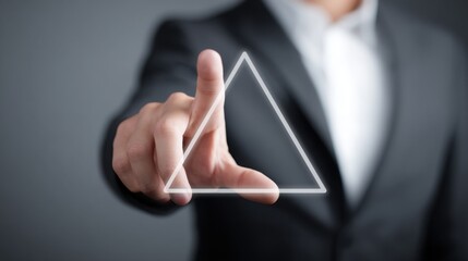 Businessman's hand touching a triangle symbolizing emotional strategy framework for tone-aligned decision making