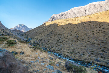 The scenic view of Reşko summit in the Sat (Cilo) mountains, Serpel and Horgedim plateau with its glaciers and glacier rivers in Hakkari, Turkey.