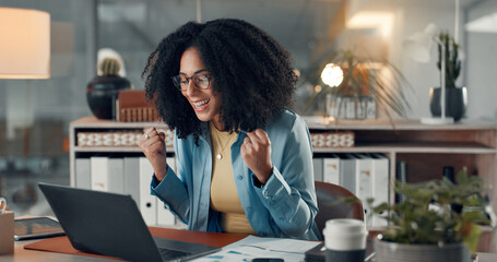 Happy, business woman or night success with laptop for winning, good news or acchievement in office. Excited, female person or working late with smile or fist pump for productivity bonus or promotion