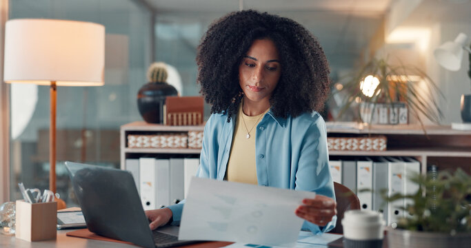 Reading, document and woman with laptop, office or serious for data entry, online and graph for web. Review, charts and African person with financial report, info and accountant with tech in business - Powered by Adobe