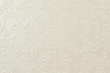 Close-up of a cream-colored embossed wallpaper with intricate floral patterns and designs.