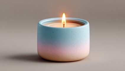Close-up of a lit candle in a pastel-colored ceramic container, casting a gentle glow
