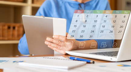 Businesswoman using tablet with digital calendar and task planner interface to manage schedule and...