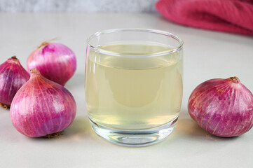 Onion juice in a glass cup.