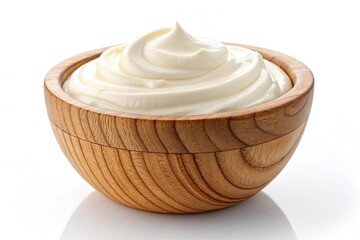 Creamy mayonnaise in a wooden bowl isolated on white background