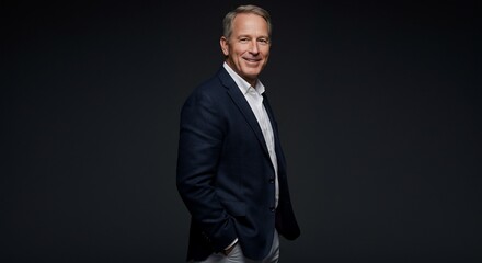 Obraz premium Confident Businessman in Suit Smiling Portrait