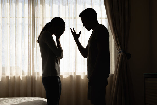 unhappy crying frightened woman, aggressive man shouting at home. Angry husband emotionally arguing screaming shouting to scared wife, verbal abuse, domestic violence relationship