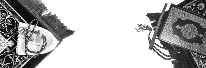 Quran with prayer mate, Rehal with open Quran on Muslim prayer mat indoors. Space for text - Image...